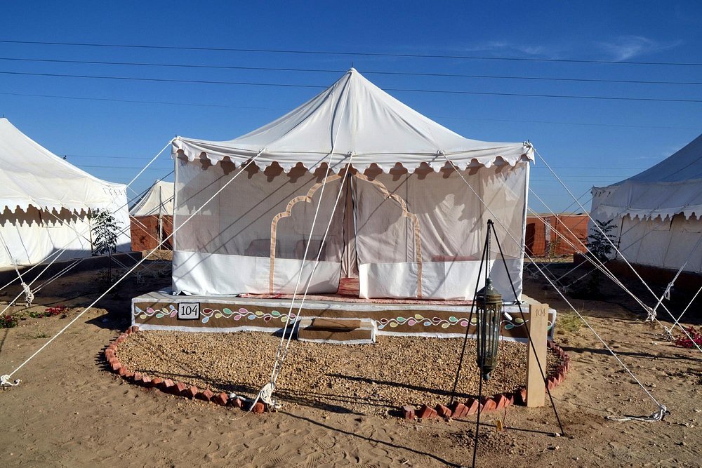 Luxury Swiss Canvas Tent Interior with King Bed and Attached Bathroom at Royal Desert Camp Jaisalmer